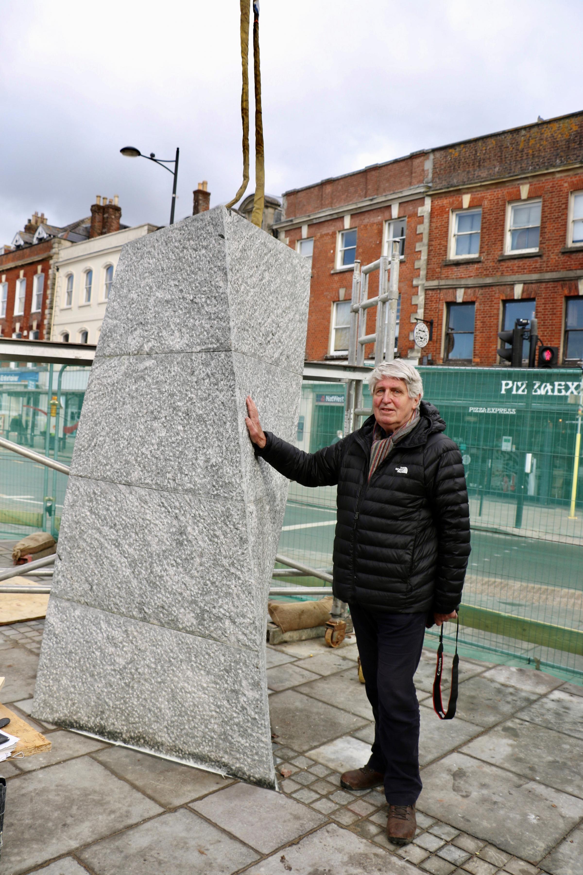 Artist John Maine pictured with his almost installed sculpture, Turning Point. Picture by Spencer Mulholland 